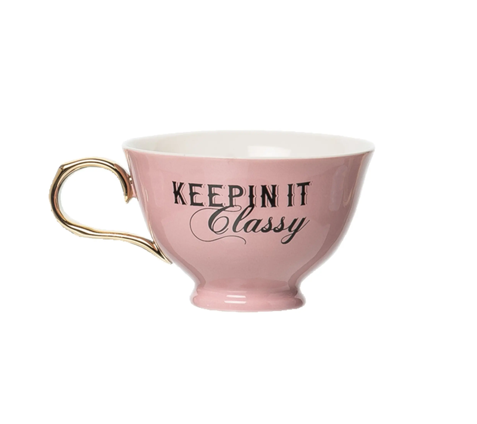 pink teacup with gold handle that has the phrase keepin it classy on it