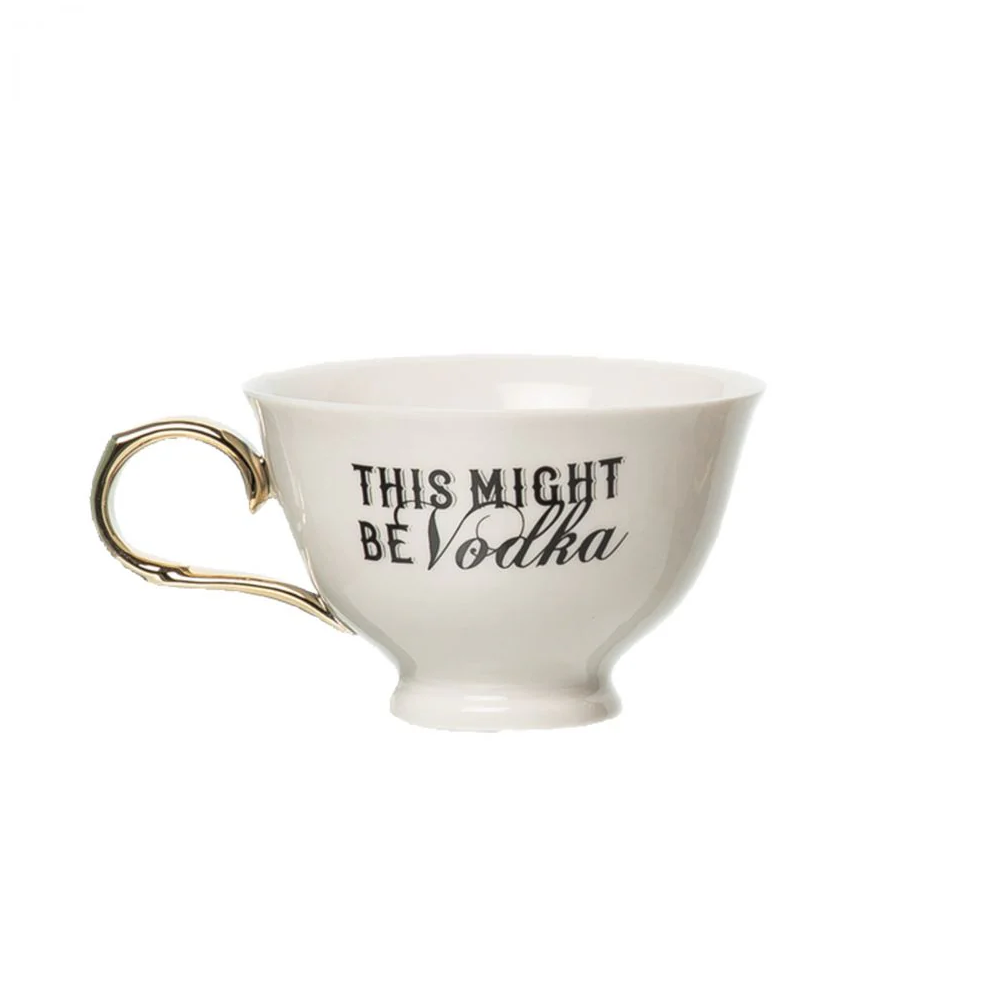 white teacup with gold handle that has the phrase this might be vodka on it